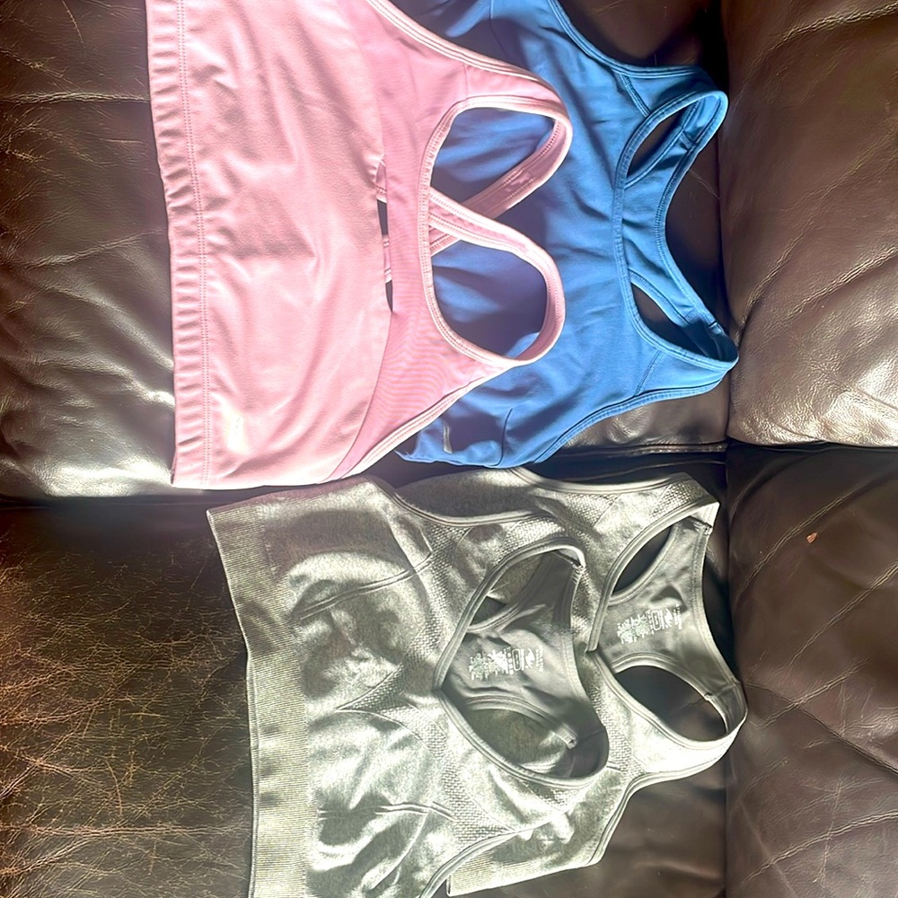 Set of 4 sports bras gently worn size medium brand is athletics works
